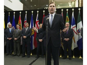 Finance Minister Bill Morneau holds a news conference with his provincial and territorial counterparts after concluding a meeting in Ottawa, Monday December21, 2015.