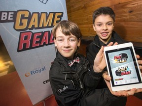 Nepean Raiders minor peewee AA players and App testers Carson Hicks, 11, left, and Marco Peloso, 11, were on hand for a press conference at the Canadian Tire Centre as the Ottawa Senators Foundation in partnership with DIFD and The Royal, collaborate to help young athletes take care of their minds with a smartphone app called Be Game Ready.