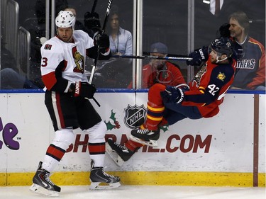 Florida Panthers center Quinton Howden (42) collides with Ottawa Senators defenseman Marc Methot (3) in the first period.