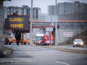 OC Transpo closed dedicated busway between Lees and Hurdman stations rerouting buses in the area. Photo taken Monday December 21, 2015.