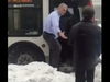 A frame from a video posted by Adriesca Julot shows an unnamed OC Transpo driver standing in the snow to help passengers get on his bus.