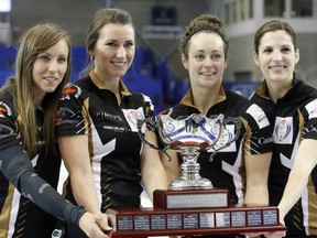 Ottawa's Rachel Homan, left, and teammates Emma Miskew (third), Joanne Courtney (second) and Lisa Weagle (lead) celebrate their win over Val Sweeting's Edmonton-based rink in the Canada Cup final on Sunday Dec. 6, 2015.