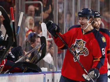 Jaromir Jagr #68 of the Florida Panthers talks it up with teammates during a break in the action.