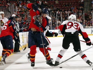 Jaromir Jagr #68 of the Florida Panthers tangles with Mika Zibanejad #93 of the Ottawa Senators during first period action.