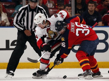 Jussi Jokinen #36 of the Florida Panthers faces off against Jean-Gabriel Pageau #44 of the Ottawa Senators.