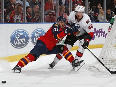 Patrick Wiercioch #46 of the Ottawa Senators defends against Vincent Trocheck #21of the Florida Panthers during first period action.