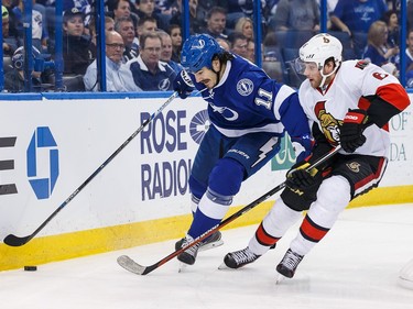 Brian Boyle #11 of the Tampa Bay Lightning skates against Bobby Ryan #6 of the Ottawa Senators during the first period.