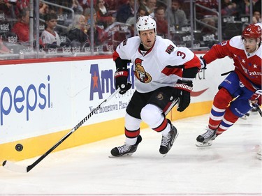 Marc Methot #3 of the Ottawa Senators skates past Tom Wilson #43 of the Washington Capitals in the second period.