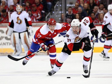 Mark Stone #61 of the Ottawa Senators skates past T.J. Oshie #77 of the Washington Capitals in the third period.