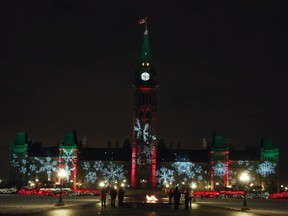 The Parliament Buildings in Ottawa are shown with Christmas lights, Monday, December 22, 2014. Dr. Andrea McCrady the Dominion Carilloneur will be among 11 countries carillonneurs playing Silent Night on December 24 to mark the 100th anniversary of the Christmas truce during the war. THE CANADIAN PRESS/Fred Chartrand