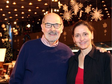 Peter Herrndorf, president and CEO of the National Arts Centre, with Karen Donnelly, principal trumpet of the NAC Orchestra, at the orchestra's annual free Christmas FanFair Concert held in the NAC Main Foyer on Sunday, December 13, 2015, in support of the Ottawa Food Bank and Snowsuit Fund.