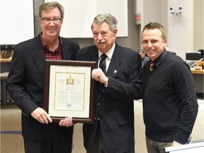 Peter Ryan receives a Mayor's City Builder Award from Mayor Jim Watson, left, and Rideau-Goulbourn ward Coun. Scott Moffatt.