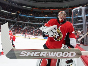 Craig Anderson #41 of the Ottawa Senators grabs his game stick as he completes his warmup.