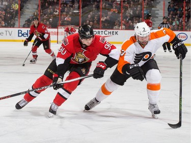 Alex Chiasson #90 of the Ottawa Senators rushes for a loose puck against Radko Gudas #3 of the Philadelphia Flyers. Gudas was suspended by the NHL for a hit delivered to the head of Mika Zibanejad Tuesday night.