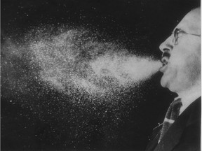 This image of droplets spreading in a sneeze, a principal way in which the cold virus is transmitted, was captured by high-speed photography in the 1940s.
