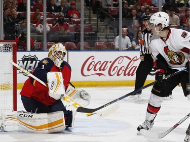 Florida Panthers goaltender Roberto Luongo (1) deflects a shot by Ottawa Senators center Jean-Gabriel Pageau (44) during the second period.