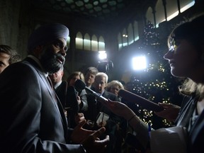 Defence Minister Harjit Sajjan answers questions outside the House of Commons Monday.