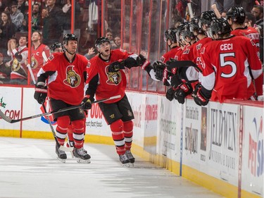 Bobby Ryan #6 of the Ottawa Senators celebrates his second period goal against the San Jose Sharks with Marc Methot #3 at the players' bench.