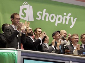 shopify-ceo-tobias-lutke-center-wearing-hat-is-celebrated