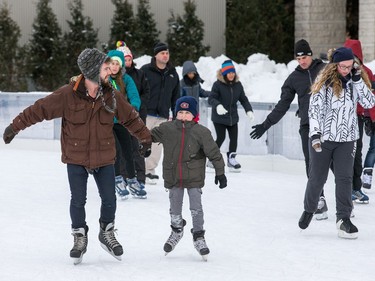 Skaters make use of the Rink of Dreams at city hall.