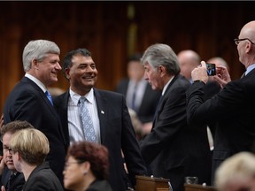 Former prime minister and Conservative MP Stephen Harper, left, poses for a photo after voting for a new Speaker of the House of Commons last week.