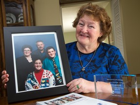 Teresa Buffone, with a photo of her family, had never heard of myotonic dystrophy when her nephew died suddenly of complications from it. But now it has taken over her life. Her husband, who died in 2012, had the disease, and her son and her daughter also have it. Teresa has become a tireless advocate for changes to help patients with the disease get better care.