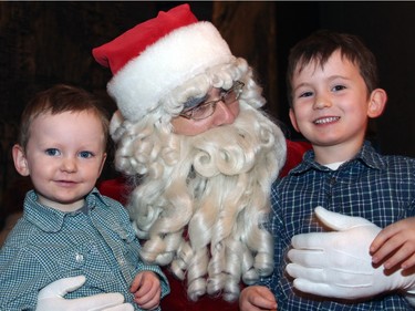 The annual Christmas FanFair Concert hosted Sunday, December 13, 2015, by the National Arts Centre Orchestra Players' Association in the NAC Main Foyer included a visit from Santa, seen with Marty Howard, three, and his big brother Aaron, six.