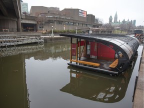 The Rideau Canal at the NAC awaits cold weather so it can become the Worlds Largest Skating Rink like the sign says.