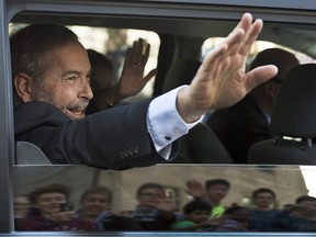 NDP Leader Tom Mulcair waves to supporters during the federal election campaign.