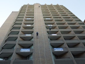 The former National Hotel, site of a charity rappelling event  in 2012, would be demolished to make way for a hotel and condominium development.