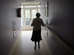A woman walks in a corridor