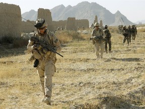 Canadian soldiers on  foot patrol near the Afghan village of Haji Baba in 2009.