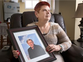 A home invasion left Danny Pietersma dead and his wife, Sharlene, seen here with a photo of Danny, barely clinging to life. Her grandchildren were also present at the time.