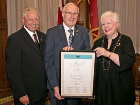 Gary Whitten receives his Ontario Senior Achievement Award from Elizabeth Dowdeswell, lieutenant-governor of Ontario, and Mario Sergio, minister responsible for Seniors Affairs.