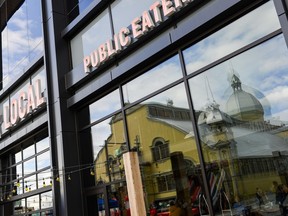 Aberdeen Pavilion reflected on the glass of the Local Public Eatery across the street at Lansdowne Park on Saturday, Nov. 7, 2015.