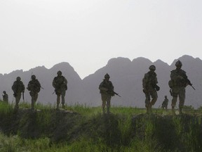 Canadian soldiers patrol an area in the Dand district of southern Afghanistan on Sunday, June 7, 2009. Canadian units that fought in Afghanistan are being considered for battle honours by the Harper government, which is casting around for ways to commemorate the conflict as it draws to a close after more than a decade.