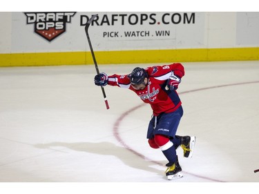 Washington Capitals left wing Alex Ovechkin (8) celebrates just after scoring his 500th career goal during the second period of a NHL hockey game against the Ottawa Senators in Washington, D.C., Sunday, Jan. 10, 2016.
