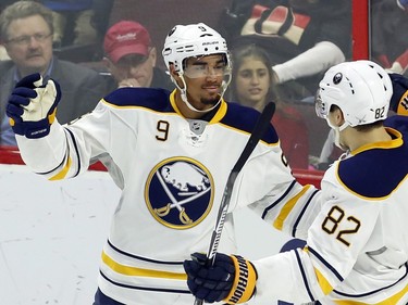 Buffalo Sabres' Evander Kane (9) celebrates his goal against the Ottawa Senators with teammate Marcus Foligno (82) during first period NHL action.