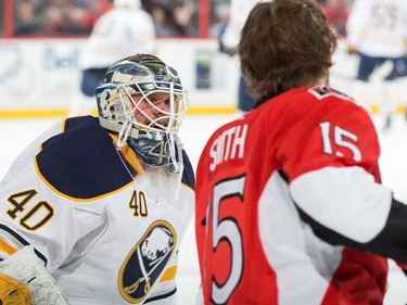 Robin Lehner #40 of the Buffalo Sabres talks with former teammate Zack Smith #15 of the Ottawa Senators during the warm up.