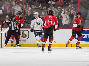 Bobby Ryan #6 of the Ottawa Senators celebrates his second period goal with teammate Cody Ceci #5 as Mark Pysyk #3 of the Buffalo Sabres looks on.