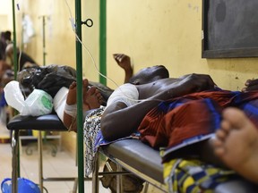 Wounded people rest at the Yalgado Hospital in Ouagadougou following a jihadist attack on January 16, 2016. At least 26 people, many of them foreigners, were killed in an attack overnight on a top hotel in the capital of Burkina Faso, the latest country to be drawn into a regional jihadist battle against the West and its allies.