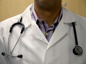 A doctor wears a stethoscope.