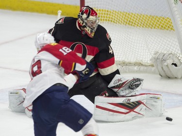 Ottawa Senators goalie Craig Anderson watches a shot from Florida Panthers right wing Reilly Smith go wide of the net during first period NHL action.
