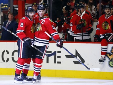 Chicago Blackhawks defenseman Duncan Keith (2) celebrates his goal with teammate center Jonathan Toews (19) during the second period of an NHL hockey game against the Ottawa Senators Sunday, Jan. 3, 2016, in Chicago.