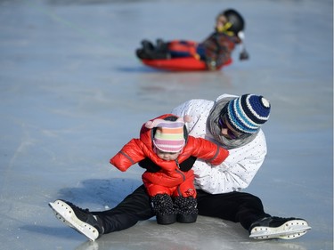 Elizabeth (9 months) and Becky Kong enjoy the opening day of the Rideau Canal Skateway on Saturday, Jan. 23, 2016.