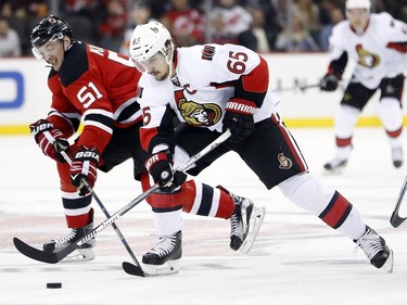 Ottawa Senators defenseman Erik Karlsson (65), of Sweden, skates against New Jersey Devils center Sergey Kalinin (51), of Russia, during the second period.