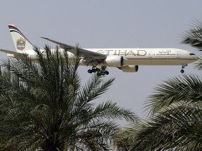 File photo of an Etihad Airways plane preparing to land in Abu Dhabi Airport.