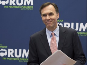 Finance Minister Bill Morneau smiles after speaking at the Munk School of Global Affairs in Toronto on Wednesday, January 13, 2016.