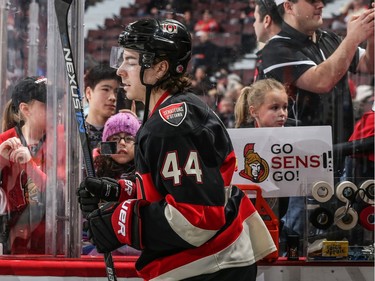 A young fans holds a sign saying "Go Sens Go" as Jean-Gabriel Pageau #44 of the Ottawa Senators walks out to the ice for the warmup.