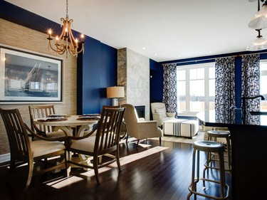 Navy blue and grasscloth combine for a memorable coastal vibe that’s both sophisticated and casual in Tamarack’s Hudson townhome. In this space, mixing blue and sticking with one hue and varying its intensity helps to exude a relaxing atmosphere.